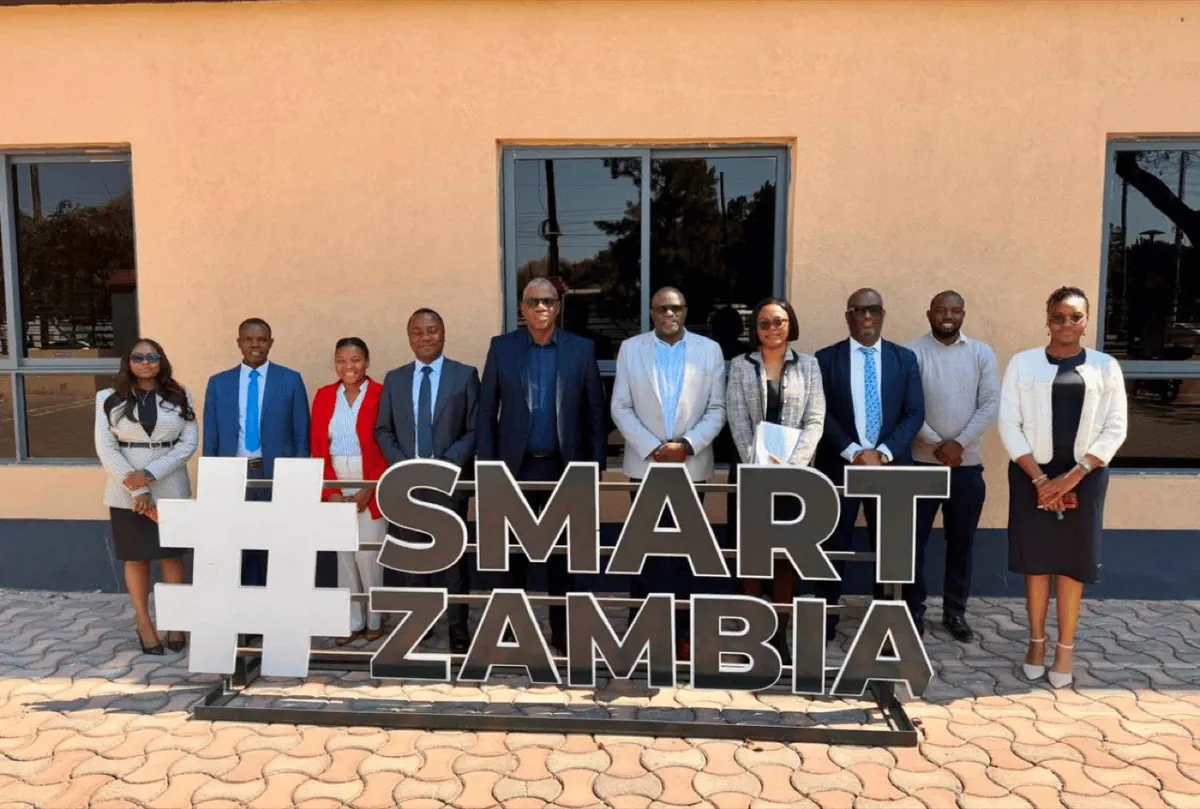 AMIZ and SMART Zambia representatives gathered outside the SMART Zambia Institute offices